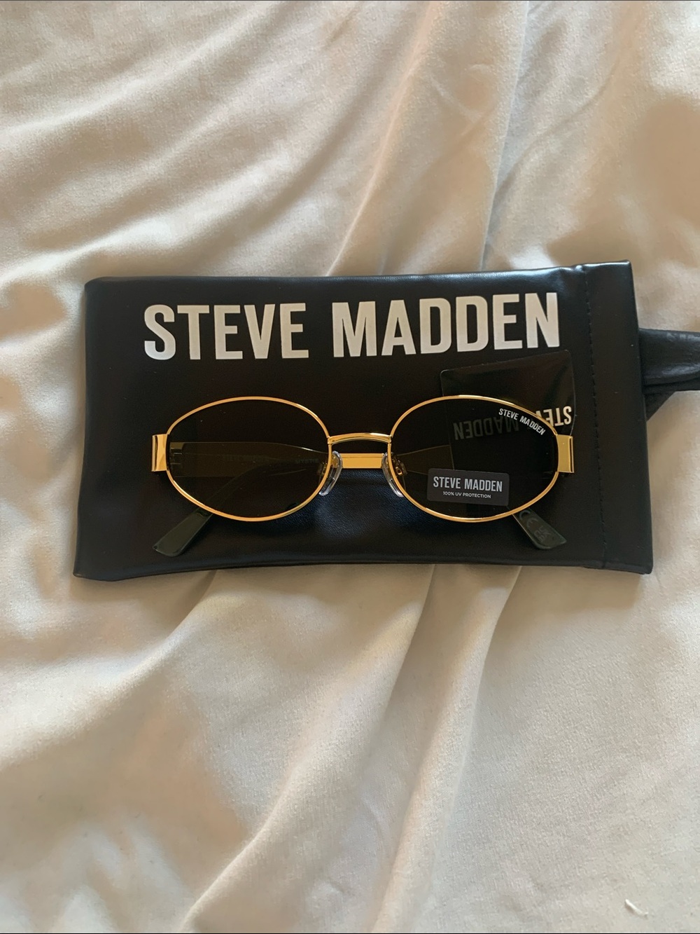 Steve Madden Gold Metal Oval Sunglasses with Dark Lenses